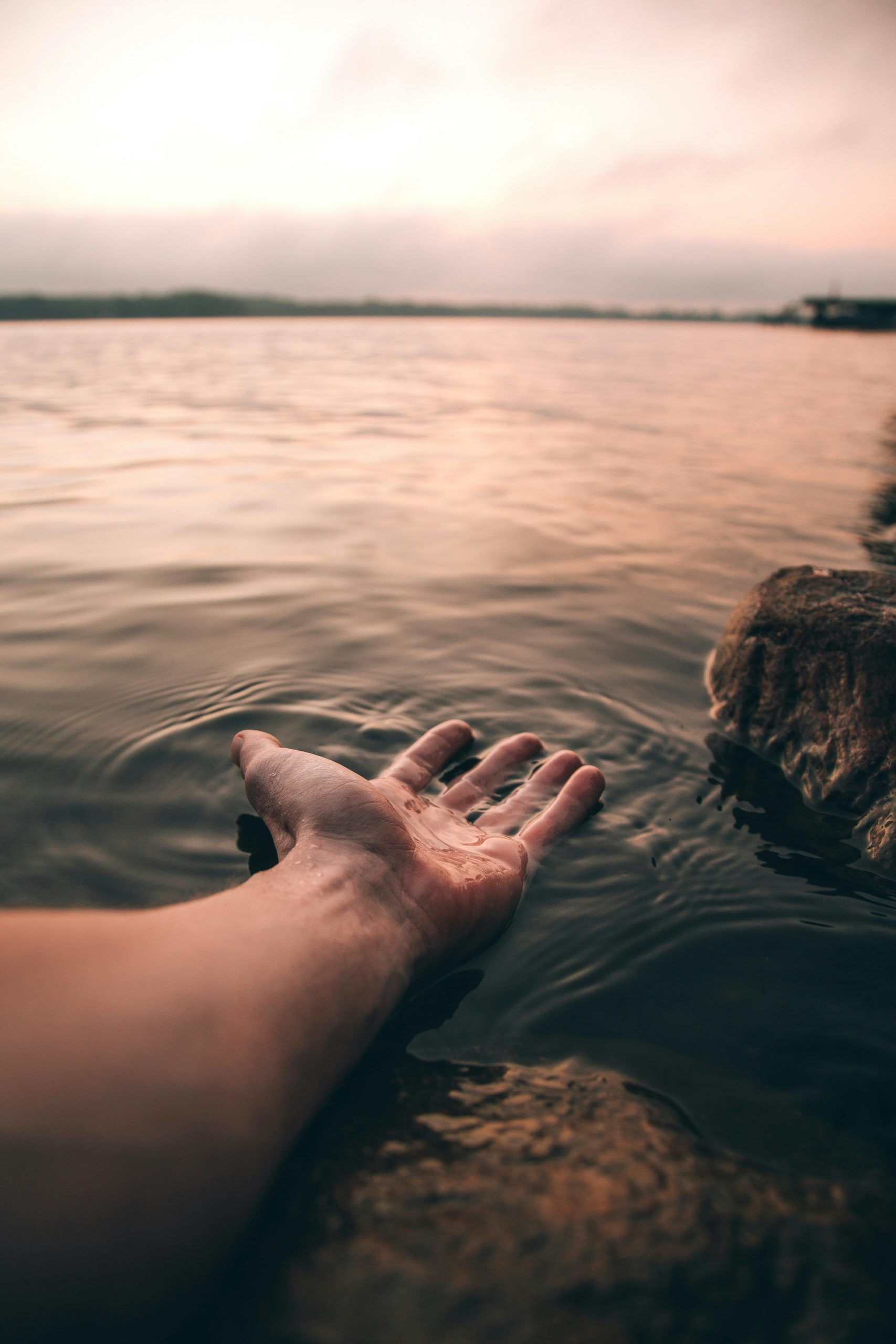 Outstretched Hands Over Water by Josh Hild