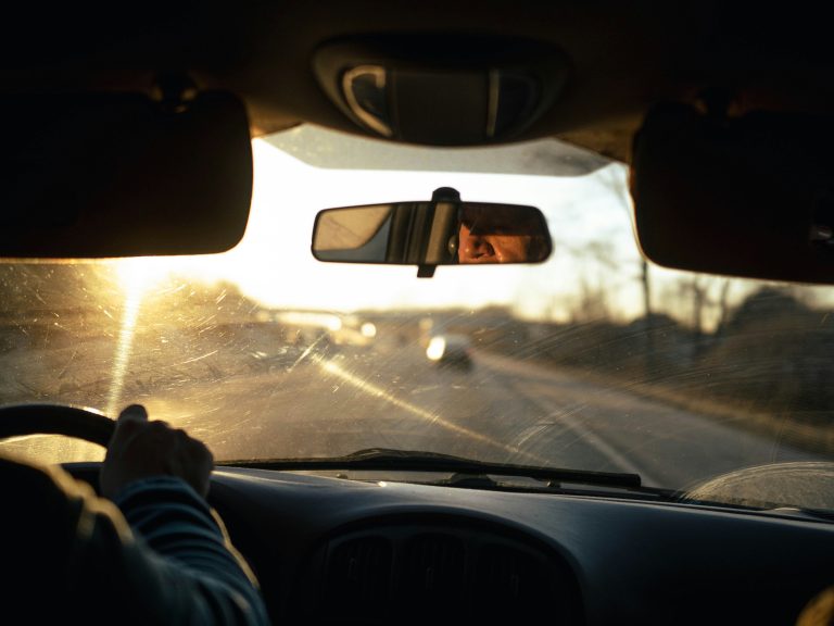 Steering wheel with morning sun by Joshua Fernandez